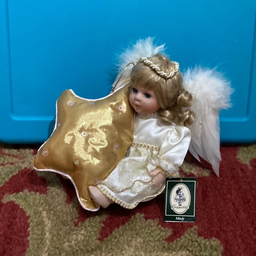 Geppeddo angel with star pillow porcelain face doll